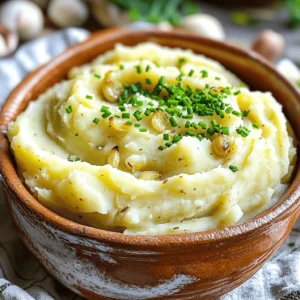 - 2 pounds russet potatoes, peeled and cut into 1-inch cubes - 1 whole head of garlic - 4 tablespoons unsalted butter, at room temperature - 1/2 cup heavy cream, warmed - 1/2 cup sour cream, at room temperature - Salt and freshly ground black pepper, to taste - Fresh chives, finely chopped (for garnish) Gathering the right ingredients is key to making rich and creamy roasted garlic mashed potatoes. Start with russet potatoes. They give a fluffy texture, perfect for mashing. Next, grab a whole head of garlic. Roasting it brings out a sweet, mellow flavor that makes these mashed potatoes shine. You’ll also need unsalted butter and heavy cream. These add richness, making the dish feel indulgent while keeping it smooth. Sour cream brings a touch of tang that balances the flavors. Don’t forget salt and black pepper for seasoning. Finally, fresh chives add a pop of color and a mild onion note. - Alternative potato types: You can use Yukon Gold for a creamier taste or red potatoes for a waxier texture. - Lightening options: Low-fat sour cream and cream can cut calories without losing flavor. - Garlic alternatives: If you’re short on time, garlic powder or prepared garlic can work in a pinch, but they won’t give the same depth. Experimenting with these options can help you find your favorite blend. Feel free to mix and match! For the full recipe, check the details above. To make roasted garlic, first, preheat your oven to 400°F (200°C). Take a whole head of garlic and slice off the top. This exposes the cloves inside. Drizzle some olive oil over the exposed parts. Wrap the garlic tightly in aluminum foil. Roast it in the oven for about 30-35 minutes. You want the garlic to be soft and golden brown. For best caramelization, check it halfway through. This way, you ensure even cooking and rich flavor. While the garlic roasts, prepare your potatoes. Fill a large pot with the peeled and cut russet potatoes. Cover them with cold water and add a pinch of salt. Bring the pot to a boil over medium-high heat. Cook the potatoes for 15-20 minutes. They should be fork-tender. To avoid watery mashed potatoes, drain them well. After draining, return the potatoes to the pot for one minute. This helps remove extra moisture. Now it's time to mash! You can use a potato masher or an electric hand mixer. Each tool gives a different texture. For a creamy result, I prefer a hand mixer. Once you mash the potatoes, add the roasted garlic, butter, heavy cream, and sour cream. Mix until smooth. The ideal consistency is creamy but not runny. If you overwork the potatoes, they can become gummy. So, mix just until everything blends well. For great roasted garlic mashed potatoes, seasonings are key. I love to add thyme or rosemary for a fresh kick. These herbs pair well with garlic, enhancing its rich flavor. Using room temperature ingredients is also important. It helps the butter and cream mix well, giving the potatoes a smooth texture. Cold ingredients can make your mash lumpy. These mashed potatoes go well with many main dishes. They are perfect next to roast chicken or steak. Try serving them with grilled salmon for a lighter option. When it comes to presentation, think fun! Use a deep bowl for serving. Top the potatoes with a sprinkle of chives for a pop of color. You can even make a little well in the center and drizzle some olive oil for flair. For the full recipe, check out the link provided. {{image_4}} You can easily change up the flavor of roasted garlic mashed potatoes. One great idea is to add cheese. Mixing in parmesan or cheddar gives the dish a rich taste. Just stir in a cup of shredded cheese right before serving. The heat will melt it nicely. Another fun option is to experiment with roasted herbs. Try adding thyme or rosemary. These herbs bring a fresh taste to the creamy potatoes. Just chop them finely and mix them in after mashing. For those who follow a vegan diet, there are simple swaps. Instead of butter, use vegan butter or olive oil. For the cream, almond or coconut milk works well. These changes keep the dish creamy and delicious. If you need to keep it gluten-free, you're in luck! The basic ingredients are already gluten-free. Just watch for any added ingredients that may contain gluten. Stick to pure forms of butter and cream. Roasted garlic mashed potatoes are not just tasty. They can fit many diets and preferences. Explore these variations to find what you love! For the complete recipe, check out the Full Recipe. To store your roasted garlic mashed potatoes, let them cool first. Place them in an airtight container. This keeps moisture in and prevents drying. You can store them in the fridge. Try to use them within three days for the best taste. If you have a lot left, freezing is a great option. Scoop portions into freezer-safe bags or containers. Remove as much air as possible. Label the bags with the date. You can freeze them for up to two months. When you're ready to eat, thaw the potatoes overnight in the fridge. Reheat them on the stove or in the microwave. Add a splash of cream or milk for creaminess. In the fridge, roasted garlic mashed potatoes last about three days. If you freeze them, they can last for about two months. Watch for signs of spoilage. If they smell sour or have a strange color, it's time to toss them. Always trust your senses. Better safe than sorry! Can I make these mashed potatoes ahead of time? Yes, you can make these mashed potatoes ahead of time. Prepare them as normal, then cool them down. Store them in the fridge for up to two days. When you are ready to serve, reheat with a little cream or milk for a creamy texture. What is the best way to reheat mashed potatoes? To reheat mashed potatoes, place them in a pot over low heat. Add a splash of cream or milk to keep them moist. Stir often until they heat through. You can also use the microwave, but cover them to avoid drying out. How do I prevent the potatoes from turning brown? To keep your potatoes from turning brown, soak them in cold water after cutting. This stops oxidation. If they sit too long, rinse them before cooking. Using russet potatoes helps, as they brown less than others. In this post, we explored how to make roasted garlic mashed potatoes. You learned about key ingredients, like potatoes, garlic, and butter, plus great tips for flavor. I also shared ways to switch up the recipe and serve it nicely. Mastering mashed potatoes brings joy to any meal. With practice and these tips, you can impress everyone at your table. Enjoy creating and sharing your perfect mashed potatoes!