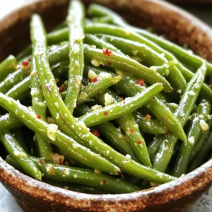 To make garlic roasted green beans, you'll need these simple items: - 1 pound fresh green beans, trimmed and rinsed - 4 large cloves garlic, finely minced - 3 tablespoons extra virgin olive oil - 1 teaspoon freshly grated lemon zest - 1 teaspoon balsamic vinegar - ½ teaspoon red pepper flakes (optional for heat) - Sea salt and freshly ground black pepper to taste - 2 tablespoons finely grated Parmesan cheese (optional) I always prefer fresh green beans for this recipe. They taste better and have a nice crunch. Fresh beans roast evenly and soak up the flavors well. If you can’t find fresh ones, frozen beans work too. Just make sure to thaw and drain them first. They may not be as crisp, but they will still taste great. You can change some ingredients if you need to. If you don’t have garlic, try using garlic powder. Instead of lemon zest, you can use orange zest for a different flavor. If you want a different vinegar, try red wine vinegar. For a dairy-free option, skip the Parmesan cheese or use a vegan cheese instead. These swaps keep the dish tasty and fun! To start, gather your ingredients. You will need: - 1 pound fresh green beans, trimmed and rinsed - 4 large cloves garlic, finely minced - 3 tablespoons extra virgin olive oil - 1 teaspoon freshly grated lemon zest - 1 teaspoon balsamic vinegar - ½ teaspoon red pepper flakes (optional for heat) - Sea salt and freshly ground black pepper to taste - 2 tablespoons finely grated Parmesan cheese (optional) First, preheat your oven to 425°F (220°C). This step is key for crispy beans. Next, take a large mixing bowl and add the green beans. Toss in the minced garlic, olive oil, lemon zest, and balsamic vinegar. If you like a little heat, add red pepper flakes. Season with sea salt and black pepper to taste. Mix everything well. You want each bean coated with flavor. Now, it’s time to roast! Spread the green beans on a large baking sheet. Make sure they lie flat in a single layer. This helps them roast evenly. Place the baking sheet in the oven and roast for 15-20 minutes. Halfway through, give the beans a toss. This ensures they cook evenly. You’ll know they’re done when they’re tender but still have a slight crunch. Once out of the oven, if you like, sprinkle grated Parmesan cheese on top. The heat will melt it slightly, making it even better. Transfer the roasted green beans to a nice serving dish. Serve them warm to your family or guests. They pair well with many main dishes. Try them with grilled chicken or fish. You can also serve them as a stand-alone snack. For the full recipe, please see the earlier section. Enjoy your tasty green beans! To boost the taste of garlic roasted green beans, add a squeeze of lemon. Lemon brings brightness and freshness. You can also use fresh herbs like thyme or rosemary. These herbs add depth and aroma. If you love heat, try adding more red pepper flakes. Just be careful not to overdo it! For the best texture, spread the beans on the baking sheet. Make sure they are in a single layer. This helps them roast evenly. Toss them halfway through cooking to ensure all sides get crispy. If you want them extra crispy, leave them in for a few more minutes. Serve your garlic roasted green beans in a nice dish. You can sprinkle extra Parmesan cheese on top for a gourmet look. Adding a few lemon wedges next to the beans can enhance the presentation. It also invites your guests to add more flavor if they wish. For a pop of color, place fresh herbs on top before serving. This will make your meal look and taste amazing! You can find the full recipe for garlic roasted green beans [Full Recipe]. {{image_4}} You can mix in other veggies with garlic roasted green beans. Carrots, bell peppers, and zucchini work well. Just cut them into similar sizes. This way, they all cook evenly. Toss them with the green beans in the same mix for great flavor. You can also try adding cherry tomatoes for a pop of color and sweetness. Add herbs to change the taste of your garlic roasted green beans. Fresh thyme or rosemary adds a lovely aroma. A sprinkle of smoked paprika gives a warm, savory hint. You can also try a dash of cumin for a unique flavor. These twists make your dish exciting and fresh each time. This recipe is already vegetarian. To make it vegan, simply skip the Parmesan cheese. You can also add nutritional yeast for a cheesy flavor without dairy. It’s a great way to keep it creamy and flavorful. Enjoy these garlic roasted green beans as a side dish or main meal. Each variation keeps it fun and tasty! For the full recipe, check out the detailed instructions provided earlier. After enjoying your garlic roasted green beans, you might have leftovers. Cool the beans down first. Then, place them in an airtight container. They stay fresh in the fridge for about 3-4 days. When ready to eat, check for any signs of spoilage. If they look good, you can enjoy them again! If you have more leftovers than you can eat, freezing is a great option. First, let the beans cool completely. Then spread them on a baking sheet in a single layer. Freeze them for about an hour. This step helps the beans stay separate. After freezing, transfer them to a freezer-safe bag. They can last up to 3 months in the freezer. Label the bag with the date so you know when to use them. Reheating garlic roasted green beans is simple. You can use the oven or a microwave. For the oven, preheat it to 350°F (175°C). Spread the beans on a baking sheet and heat for about 10 minutes. If you use a microwave, place the beans in a safe dish. Heat them for 1-2 minutes, stirring halfway. This method keeps them tasty and warm. For extra flavor, add a splash of olive oil or a sprinkle of salt before serving. Enjoy your meal! To make garlic roasted green beans, start by preheating your oven to 425°F (220°C). In a big bowl, mix 1 pound of fresh green beans with 4 minced garlic cloves, 3 tablespoons of olive oil, 1 teaspoon of lemon zest, and 1 teaspoon of balsamic vinegar. If you like spice, add ½ teaspoon of red pepper flakes. Season with sea salt and black pepper. Toss everything until the beans are well coated. Spread the beans on a baking sheet in a single layer. Roast them for 15-20 minutes, tossing halfway. When they are tender and crisp, serve hot. You can find the Full Recipe for more details. Yes, you can prepare garlic roasted green beans ahead of time. You can trim and wash the green beans and mix them with the garlic and oil. Store this mix in the fridge for up to a day. When you’re ready to eat, just roast them as directed. This makes dinner prep easier, and you can enjoy more time with your guests. Garlic roasted green beans pair well with many dishes. You can serve them alongside grilled chicken or fish for a balanced meal. They also complement pasta dishes, like spaghetti or fettuccine. If you want a vegetarian option, try them with quinoa or rice. Their bright flavor adds a nice touch to any plate. This post covered garlic roasted green beans from ingredients to serving ideas. Fresh or frozen beans work well, and you can swap key ingredients easily. Roasting creates a rich flavor, and adding herbs boosts it even more. Don’t forget about storage; knowing how to keep leftovers can help. Remember, you can customize this dish with other veggies or herbs. Enjoy experimenting with flavors! Roasted green beans can fit any meal.
