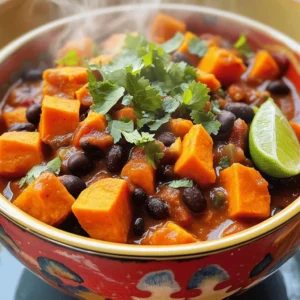 To make this savory sweet potato black bean chili, gather these main ingredients: - 2 medium sweet potatoes, peeled and cut into 1-inch cubes - 1 can (15 oz) black beans, thoroughly rinsed and drained - 1 can (14.5 oz) diced tomatoes - 1 medium onion, finely chopped - 2 cloves garlic, finely minced - 1 bell pepper, diced - 1 cup vegetable broth - 2 teaspoons ground cumin - 1 teaspoon smoked paprika - 1 teaspoon chili powder - ½ teaspoon dried oregano - Salt and freshly cracked pepper to taste - 2 tablespoons extra virgin olive oil - Fresh cilantro, chopped, for garnish - Lime wedges, for serving If you want to take your chili to the next level, you can add some optional ingredients: - 1-2 jalapeños, diced for heat - 1 cup corn, for sweetness and crunch - 1 teaspoon cayenne pepper, for extra spice - 1 tablespoon apple cider vinegar, to brighten flavors This chili is not just tasty; it’s also packed with nutrition. Here’s a quick breakdown: - Calories: About 250 per serving - Protein: 10 grams - Fat: 7 grams - Carbohydrates: 45 grams - Fiber: 12 grams - Sugars: 5 grams This dish is rich in fiber and protein, making it a filling meal. It also provides a good source of vitamins A and C from the sweet potatoes and peppers. For the full recipe, check out the provided link! Start by gathering your ingredients. You need sweet potatoes, black beans, diced tomatoes, onion, garlic, bell pepper, vegetable broth, spices, olive oil, salt, and pepper. Make sure to peel and cube the sweet potatoes into 1-inch pieces. Rinse the black beans well and drain them. Chop the onion and garlic finely. Dice the bell pepper. This will set you up for success! Heat olive oil in a large pot over medium heat. Add the chopped onion and bell pepper. Sauté them for about 5 minutes until they are soft. Then, add the minced garlic. Stir for 1 minute until you smell its great aroma. Next, add the sweet potatoes, diced tomatoes, and vegetable broth. Sprinkle in cumin, smoked paprika, chili powder, oregano, and season with salt and pepper. Mix everything together. Bring the mix to a gentle boil, then lower the heat. Cover the pot and let it simmer for 25-30 minutes. The sweet potatoes should be tender and easy to fork. Finally, fold in the black beans and let them warm for about 5 minutes. Taste it and adjust the seasoning if you want. Serve the chili hot in vibrant bowls. Top each bowl with fresh cilantro and a lime wedge. The lime adds a nice burst of flavor. For more richness, you can add a dollop of avocado or sour cream. This chili tastes great and looks beautiful on the table. For the full recipe, check out the [Full Recipe] link! To boost flavors in your sweet potato black bean chili, use a few easy tricks. Start by sautéing your onions and peppers in olive oil. This step builds a solid flavor base. Make sure they soften and release their natural sugars. Next, add garlic for aroma, stirring it briefly. This brings out the richness in your chili. Using smoked paprika adds depth. It gives a subtle, smoky taste that lifts the dish. Always taste as you go. Adjusting the seasoning lets you find the perfect balance. Many people rush when cooking chili. Give your sweet potatoes enough time to soften. If they are still hard, your chili will not taste great. Another mistake is ignoring the beans. Be sure to fold them in gently so they don’t break apart. Also, don’t skip the lime! It brightens the flavors. Lastly, avoid overcooking the chili. A gentle simmer is enough to meld the flavors without losing texture. If you like heat, there are simple ways to spice things up. Start with mild chili powder, then add cayenne or hot sauce for more warmth. You can also use diced jalapeños for a fresh kick. For less heat, choose milder peppers and skip the extra spices. Always taste before serving. This way, you can adjust the spice level to suit everyone’s palate. {{image_4}} This chili is already vegetarian and vegan. You can enhance it by adding more veggies. Try using zucchini, corn, or mushrooms. These add texture and flavor. You can also swap the vegetable broth for a homemade version. Just boil water with herbs and spices to boost taste. This chili is gluten-free as is. If you want, you can add gluten-free grains. Quinoa or brown rice make great additions. Cook them separately and mix them in before serving. This will give you a hearty meal without gluten. You can make this chili your own with fun add-ins. Try adding fresh spinach or kale for extra greens. A splash of lime juice brightens the flavors. For a smoky kick, add chipotle peppers in adobo sauce. You can also top it with avocado, cheese, or yogurt. These toppings add creaminess and contrast. Check out the Full Recipe for more ideas! To keep your sweet potato black bean chili fresh, first, let it cool down. Then, pour it into an airtight container. This helps prevent spills and keeps the flavor locked in. You can store it in the fridge for up to three days. Make sure to label the container with the date for easy tracking. If you want to save your chili for later, freezing is a great option. Use freezer-safe bags or containers. Pour the chili into the bags, leaving some space for expansion. Seal them tightly to avoid freezer burn. You can freeze your chili for up to three months. Remember to label the bags with the date so you know when to use them. When you're ready to enjoy your chili again, there are a few ways to reheat it. The best method is to use a pot on the stove. Heat it over medium-low heat, stirring often until it's hot. If you prefer the microwave, pour the chili into a microwave-safe bowl. Cover it loosely and heat for 2-3 minutes, stirring halfway through. Always check that it’s hot all the way through before serving. For added flavor, squeeze some fresh lime juice on top before you dig in! If you do not have sweet potatoes, you can use butternut squash or regular potatoes. Both options will add a nice texture and flavor to the chili. You may also try carrots for a slightly sweeter taste. Adjust the cooking time as needed, since these veggies may take different times to cook. To add heat to your chili, you can use fresh jalapeños or serrano peppers. Chop them up and add them with the onions. You can also increase the chili powder or smoked paprika. Adding a dash of hot sauce or cayenne pepper at the end can give it an extra kick too! Yes, canned black beans work great in this recipe. They save time and still taste delicious. Make sure to rinse and drain them well before adding to the chili. This helps remove excess sodium and keeps the flavor balanced. To serve more people, just double or triple the ingredients. Keep the same cooking steps, but watch the cooking time. You may need a larger pot to accommodate the extra chili. Always taste and adjust seasoning as you increase the amounts. For the full recipe, check out the earlier section. This article covered key ingredients and cooking steps for your dish. You learned about optional ingredients for added flavor and useful tips to improve taste. We explored variations, including vegetarian and gluten-free options. You also picked up on how to store leftovers and common questions. Remember, cooking is fun, and experimenting makes it even better. Enjoy your dish and feel proud of your culinary skills!
