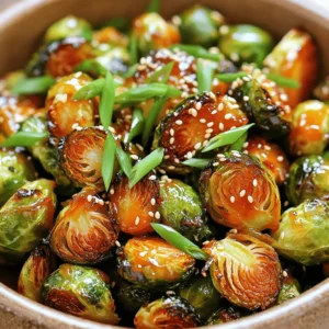 To create the best Honey Sriracha Brussels sprouts, you need the right ingredients. Here’s what to gather: - 1 pound Brussels sprouts, halved - 2 tablespoons olive oil - 2 tablespoons honey - 1 tablespoon sriracha sauce - 1 tablespoon soy sauce - 2 cloves garlic, finely minced - Salt and freshly ground black pepper, to taste - 1 tablespoon sesame seeds (for garnishing) - 2 green onions, sliced thinly (for garnishing) These ingredients come together to form a delightful mix of sweet and spicy flavors. The Brussels sprouts bring a nice crunch, while the honey and sriracha add delicious depth. The soy sauce provides umami, and garlic enhances the taste even more. Don't forget the garnishes; they add both flair and flavor to your dish! - First, preheat your oven to 400°F (200°C). This helps the Brussels sprouts cook evenly. - Next, take 1 pound of Brussels sprouts and cut them in half. This step helps them roast better. - In a large mixing bowl, add 2 tablespoons of olive oil. Toss in a good pinch of salt and black pepper. - Now, add the halved Brussels sprouts to the bowl. Mix well until they are fully coated with oil and seasoning. - Arrange the Brussels sprouts in a single layer on a baking sheet. Make sure they have space between them. - Roast the sprouts in the oven for 20-25 minutes. Stir them halfway through. This helps them crisp up nicely. - While the sprouts roast, let’s make the sauce. In a small bowl, combine 2 tablespoons of honey, 1 tablespoon of sriracha sauce, 1 tablespoon of soy sauce, and 2 cloves of minced garlic. - Whisk them together until the sauce is smooth and well mixed. This sauce brings a sweet and spicy kick. - Once the Brussels sprouts are roasted to a golden brown, take them out. - Drizzle the honey sriracha sauce over the sprouts. Toss them gently to coat them well. - Return the baking sheet to the oven. Bake the sprouts for another 5-8 minutes. This step lets the sauce caramelize and enhances the flavor. To get crispy Brussels sprouts, spacing is key. Place the sprouts on a baking sheet in a single layer. If they crowd each other, they will steam instead of roast. Roast them for about 20 to 25 minutes. Check them halfway through and stir for even cooking. If you want more crunch, add a few extra minutes to the roast time. You can adjust the sriracha to fit your heat level. If you love spice, use the full tablespoon. If you prefer a milder flavor, start with half. You can also try alternatives like chili garlic sauce or sweet chili sauce. These options can add a unique twist to your dish. You can add lime juice for a fresh kick. Nuts like chopped almonds or cashews can add crunch. They pair well with the sweet and spicy sauce. Consider serving these sprouts with grilled chicken or fish. They also work great as a side to any Asian-inspired dish. {{image_4}} To make this dish vegan, you can easily switch honey with agave or maple syrup. Both options provide a sweet taste that pairs well with the spicy sriracha. Agave syrup is thinner, while maple syrup gives a unique flavor. This change keeps the spirit of the dish intact and makes it plant-based. If you love bold flavors, try adding chili flakes or garlic powder. These ingredients enhance the heat and overall taste. A pinch of chili flakes can make a big difference. Garlic powder adds a deeper garlic flavor without the need for fresh garlic. Adjust the amount to fit your taste buds. For a sweet and savory twist, consider adding balsamic glaze or a sprinkle of brown sugar. Balsamic glaze brings a tangy sweetness that complements the sriracha. Brown sugar can caramelize beautifully, enhancing the dish's depth. Both options create a rich flavor balance that will impress everyone at the table. To store Honey Sriracha Brussels sprouts, place them in an airtight container. This helps keep them fresh. You can store them in the fridge for up to three days. Be sure to let them cool completely before sealing. This prevents moisture build-up, which can make them soggy. Reheating these Brussels sprouts can be tricky. You want them crispy! The best way is to use an oven. Preheat the oven to 350°F (175°C). Spread the sprouts on a baking sheet. Heat for about 10-15 minutes. This method keeps them crunchy. You can also use a skillet over medium heat. Just stir gently until warm. Freezing Brussels sprouts is possible, but the texture may change. If you want to freeze them, do it before roasting. Blanch them in boiling water for two minutes. Then, cool them quickly in ice water. Drain and dry them well before freezing. Store them in a freezer-safe bag. They can last for up to three months. When ready to use, thaw them in the fridge overnight before cooking. Yes, you can use frozen Brussels sprouts. However, the texture will change. Frozen sprouts may become mushy. To fix this, thaw and drain them first. Pat them dry to remove excess moisture. This helps them crisp up better when roasting. You can cook Brussels sprouts in several ways. Here are some options: - Steaming: This keeps them tender and bright green. - Sautéing: Cook in a pan with olive oil for a quick, crispy side. - Grilling: Adds a smoky flavor and nice char. - Boiling: Not recommended, as it can make them soggy. Each method gives a different taste and texture. You can prep this dish in advance. Here are some tips: - Prep the sprouts: Halve them and toss with oil and seasoning. Store in the fridge for up to a day. - Make the sauce: Whisk together the honey, sriracha, soy sauce, and garlic. Store in a sealed container. - Roasting: When ready, roast the sprouts and drizzle the sauce. Bake as directed. This saves time during busy meals. This blog post showed you how to make delicious honey sriracha Brussels sprouts. We covered the key ingredients you need, like olive oil and garlic, and went through each step clearly. You learned tips for perfect roasting and creative variations to try. Remember, small changes can make big flavors. Experiment with different spices or sauces. Enjoy this tasty dish as a side or snack. You’ll love how easy and fun it is to prepare. Happy cooking!