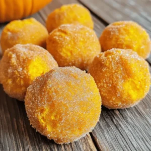 To make the best air fryer pumpkin donut holes, you need: - 1 cup canned pumpkin puree - 1/4 cup granulated sugar - 1/4 cup packed brown sugar - 1 large egg - 1 teaspoon vanilla extract - 2 cups all-purpose flour - 2 teaspoons baking powder - 1 teaspoon pumpkin pie spice - 1/2 teaspoon salt - 1/4 teaspoon baking soda - 1/4 cup milk (whole or almond milk works) - 1/4 cup unsalted butter, melted These ingredients mix together to form a soft, sweet batter. The pumpkin puree adds moisture and flavor. The sugars give a nice sweetness, while the spices create warmth. For a tasty finish, consider adding a cinnamon sugar coating. You can make it with: - 1/2 cup granulated sugar - 1 tablespoon ground cinnamon This mix adds a sweet and spiced crunch to your warm donut holes. You roll them in the sugar right after they come out of the air fryer. It's a must-try step! If you have dietary needs, here are some easy swaps: - Gluten-Free: Use a gluten-free flour blend in place of all-purpose flour. - Dairy-Free: Substitute unsalted butter with coconut oil or a dairy-free butter. - Vegan: Replace the egg with a flax egg (1 tablespoon ground flaxseed + 2.5 tablespoons water). These substitutes keep the flavors intact while making the recipe suitable for different diets. Feel free to mix and match! In a large mixing bowl, I start with the wet ingredients. I add 1 cup of canned pumpkin puree, 1/4 cup of granulated sugar, 1/4 cup of packed brown sugar, 1 large egg, and 1 teaspoon of vanilla extract. I use a whisk to mix these ingredients until smooth. This step is key for a good flavor base. Next, I grab another bowl for the dry ingredients. Here, I combine 2 cups of all-purpose flour, 2 teaspoons of baking powder, 1 teaspoon of pumpkin pie spice, 1/2 teaspoon of salt, and 1/4 teaspoon of baking soda. I whisk these together well to make sure there are no lumps. This ensures even rising and flavor throughout. Now, I incorporate the dry mixture into the wet mixture. I add the dry ingredients in parts, alternating with 1/4 cup of milk. This keeps the batter smooth. I stir gently until just combined. I make sure not to overmix. Next, I pour in 1/4 cup of melted unsalted butter and mix until it’s fully combined. The batter should feel thick but still easy to handle. I preheat my air fryer to 350°F (175°C). While it heats, I scoop small portions of the batter. I form them into balls about 1 inch wide. If I want, I can line the air fryer basket with parchment paper to prevent sticking. I arrange the dough balls in a single layer. I make sure to leave space between each ball for even cooking. I cook the donut holes for 8-10 minutes. Halfway through, I flip them for even browning. They should look golden and cooked through. Depending on my air fryer’s size, I might need to cook in batches. Once done, I immediately roll the warm donut holes in a mix of cinnamon sugar. This adds a sweet finish. I let them cool slightly before enjoying. Serving them warm gives the best taste! To get perfect donut holes, focus on mixing well. Combine wet and dry ingredients gently. This keeps the batter smooth. Avoid overmixing, as it can make your donut holes tough. When forming the balls, aim for about 1 inch in diameter. This size cooks evenly in the air fryer. One big mistake is not preheating the air fryer. If it is not hot enough, the donut holes will not cook right. Another error is overcrowding the basket. This can lead to uneven cooking and soggy spots. Always leave space between each donut hole. Lastly, don’t skip the cinnamon sugar coating; it adds great flavor! Air frying is quick and easy. Preheat your air fryer to 350°F (175°C) before cooking. Arrange the donut holes in a single layer. Flip them halfway through cooking for even browning. Cook for about 8-10 minutes. If needed, do this in batches. This way, they stay warm and delicious! Enjoy your tasty treats fresh out of the air fryer. {{image_4}} You can easily switch up the flavors in your donut holes. Here are some ideas: - Maple: Add 2 tablespoons of pure maple syrup to the wet ingredients. This gives a nice twist. - Chocolate: Mix in 1/2 cup of mini chocolate chips for a sweet surprise inside. - Nutmeg: Replace pumpkin pie spice with ground nutmeg for a different spice profile. - Cranberry: Fold in dried cranberries for a tart kick that pairs well with pumpkin. These small changes can really make your treat unique and fun. Coatings can transform your donut holes. Here are some tasty options: - Powdered Sugar: Roll the warm donut holes in powdered sugar for a sweet touch. - Chocolate Glaze: Dip them in melted chocolate for a rich finish. Let it set before serving. - Sprinkles: Add colorful sprinkles on top of the glaze for a festive look. - Toasted Coconut: Roll in toasted coconut flakes for a tropical flair. These coatings can elevate your donut holes and impress your guests. You can make these donut holes for special diets. Here’s how: - Gluten-Free: Use a gluten-free flour blend instead of all-purpose flour. Look for one that has a good binding agent. - Vegan: Replace the egg with 1/4 cup of unsweetened applesauce. Use almond milk and a plant-based butter. - Dairy-Free: Use almond milk and coconut oil instead of milk and butter. These adaptations keep the flavor while meeting dietary needs. Enjoy these tasty treats with everyone! To store your leftover pumpkin donut holes, place them in an airtight container. Make sure they cool down first. This keeps them fresh and tasty. You can store them at room temperature for up to two days. If you want to keep them longer, the fridge is a good option. In the fridge, they stay fresh for about five days. To reheat your donut holes, use the air fryer for best results. Preheat the air fryer to 300°F (150°C). Place the donut holes in the basket. Heat them for about 3-5 minutes. This will make them warm and soft again. You can also use a microwave, but they may not stay as crisp. Heat them for about 10-15 seconds. Check to see if they are warm enough. Freezing is a great way to store pumpkin donut holes for longer. First, let them cool completely. Then, spread them on a baking sheet in a single layer. Freeze for about an hour. Once frozen, transfer them to a freezer bag. Label the bag with the date. They can stay in the freezer for up to three months. When ready to eat, thaw them in the fridge overnight and reheat as needed. The best air fryers for donut holes have a basket design. They allow good air flow. Look for air fryers with a temperature range of 300°F to 400°F. This helps achieve a crispy exterior. Popular brands include Ninja, Philips, and Cosori. These models cook evenly and have easy-to-use controls. Yes, you can use fresh pumpkin! Start by roasting a pumpkin until soft. Scoop the flesh and blend it until smooth. Use this fresh puree instead of canned pumpkin. However, make sure to drain excess moisture. This keeps the dough from getting too wet. To make these donut holes healthier, consider a few swaps. Use whole wheat flour instead of all-purpose flour. This adds fiber and nutrients. You can also reduce the sugar by half. This change still keeps them sweet. Lastly, try using applesauce instead of butter. This lowers fat content while adding moisture. These donut holes taste best fresh, but they last a few days. Store them in an airtight container at room temperature. They may stay good for 2 to 3 days. For longer storage, keep them in the fridge for up to a week. You can also freeze them for up to a month. Just warm them up before serving! In this article, we explored how to make delicious air fryer pumpkin donut holes. We covered the main ingredients and optional cinnamon sugar coating. I shared step-by-step instructions for preparation and cooking. You learned tips for perfect consistency and common mistakes to avoid. We discussed fun variations and dietary adaptations. Lastly, I provided storage methods to keep your donut holes fresh. Enjoy making these tasty treats and share them with friends!