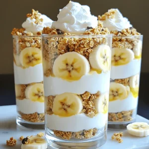 - Ripe bananas: Choose two ripe bananas for a sweet taste and creamy texture. - Greek yogurt: Use one cup of Greek yogurt. You can pick vanilla or plain. - Protein powder: Add one cup of vanilla-flavored protein powder for extra nutrition. These three key ingredients form the base of your parfait. The ripe bananas add natural sweetness. Greek yogurt gives it a creamy texture and protein. The protein powder boosts the protein content, making this dessert healthier. - Honey or maple syrup: One tablespoon adds sweetness. Use this if you like it sweeter. - Flavor extract: Add half a teaspoon of pure vanilla extract for extra flavor. These optional ingredients enhance the taste of your parfait. Honey or maple syrup can make it sweeter without much effort. The vanilla extract adds a lovely aroma that pairs well with bananas. - Whipped coconut cream: Use this for a tasty topping. It adds a nice finish. - Granola: Choose your favorite granola to sprinkle on top for crunch. - Additional banana slices: Use extra banana slices for a fresh touch. Garnishing is key to making your parfait look great. Whipped coconut cream adds a creamy layer on top. Adding more banana slices gives it a fresh look. The granola adds a satisfying crunch that contrasts the creamy layers. First, gather your ingredients. In a medium mixing bowl, combine the Greek yogurt and protein powder. Use a whisk to blend them together well. The goal is a smooth and creamy mix. If it feels too thick, add the almond milk. Start with a little, then add more if needed. You want a nice, spreadable texture. If you like it sweeter, mix in honey or maple syrup. Don’t forget the vanilla extract for extra flavor. Next, prepare your serving glasses or bowls. Begin with a generous spoonful of the creamy yogurt mix as the first layer. Then, add a layer of sliced bananas. Follow this with a layer of granola. Repeat these layers until your glass is full. Make sure the top layer is the creamy yogurt mix. This makes for a lovely finish. To help with even layers, use a spoon to press down gently. Now, it’s time for the fun part—topping the parfaits! Add a dollop of whipped coconut cream on each serving. This makes it look fancy. For a pretty garnish, add more banana slices and a sprinkle of granola on top. If you want, a mint leaf can add a pop of color. Your parfaits now look delicious and inviting! To get the perfect texture for your parfaits, adjust the almond milk. Start with half a cup, then add more if needed. If you want a thicker mix, use less milk. This step helps create that creamy layer we all love. For mixing, I suggest you whisk vigorously. This makes the yogurt and protein powder blend smoothly. A hand mixer can also do the trick if you want a fluffier texture. The way you serve your parfaits makes a big difference. Use clear glassware to show off the beautiful layers. Tall glasses or small jars work well. They add a fun look to your dessert. You can also play with flavors. Pair your parfaits with seasonal fruits like strawberries or blueberries. They add color and taste that makes each bite special. Prepping your ingredients ahead of time is smart. Slice your bananas and mix the yogurt blend early. You can store them in the fridge. This way, you have less to do when it’s time to serve. When you assemble, use a spoon to layer quickly. Start with the yogurt, then add bananas, and top with granola. This process is fast and fun. You’ll have your parfaits ready in no time. {{image_4}} You can make fun flavor twists with this parfait. Try adding cocoa powder for a chocolate banana parfait. Just mix in a tablespoon of cocoa with the yogurt. This gives a rich, chocolatey taste that pairs well with bananas. Another tasty option is to use mixed berries. Swap out bananas for fresh strawberries, blueberries, or raspberries. This adds a burst of color and tartness to your dessert. You can layer the berries with the yogurt for a refreshing change. If you want a vegan version, use plant-based yogurt. There are many tasty brands available today. Just replace Greek yogurt with your choice. You can still enjoy the creamy texture while keeping it dairy-free. For those needing gluten-free options, choose gluten-free granola. Many brands offer delicious, crunchy varieties. This way, everyone can enjoy the parfait without worry. Make your parfaits special for the holidays. Add spices like cinnamon or nutmeg for a festive touch. This warms up the flavors and makes them perfect for winter gatherings. In summer, switch to lighter fruits. Peaches or strawberries can make your parfaits bright and fresh. Their juicy sweetness pairs well with the creaminess. Enjoy these variations throughout the year for a tasty treat. To keep your Protein Banana Cream Pie Parfaits fresh, store them in the fridge. Use airtight containers to prevent drying out. If you plan to eat them within a few days, just cover the parfaits with plastic wrap or a lid. This keeps the flavors strong and the layers intact. If you want to save the yogurt mixture for later, freezing is a great option. Place the blended yogurt in freezer-safe containers. Remember to leave some space at the top for expansion. You can also freeze the banana slices separately. This way, you can assemble fresh parfaits whenever you want. In the fridge, parfaits last about three days while keeping their taste and texture. If you notice any off smells or discoloration, it’s best to toss them. Freshness is key for a great experience, so always check for spoilage signs. Yes, you can. If you want to switch from Greek yogurt, try regular yogurt, coconut yogurt, or soy yogurt. Each will change the flavor and texture. Regular yogurt is smoother but has less protein. Coconut yogurt adds a hint of coconut flavor, making it creamy. Soy yogurt is a great plant-based option. Choose what you like best! Absolutely! To make this parfait lighter, use low-fat yogurt instead of Greek yogurt. You can also skip the honey or maple syrup. For granola, choose a low-calorie or sugar-free option. You can even reduce the amount of granola in each layer. These swaps keep the taste while lowering calories. To make this parfait fun for kids, let them help with layering. Kids love to build their food! Use bright, colorful fruits like strawberries or blueberries. You can also add chocolate chips or sprinkles for a sweet touch. Serve them in fun cups or jars. This way, kids enjoy making and eating their own treat! This blog post covered how to create delicious and healthy parfaits. You learned about key ingredients like ripe bananas, Greek yogurt, and protein powder. I shared tips on achieving the best texture and presented variations for special diets. Remember, you can customize flavors and garnish for uniqueness. Enjoying these parfaits can be a fun way to nourish your body. I hope you feel inspired to try making your own!