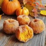 - 1 cup all-purpose flour - 1 teaspoon baking powder - 1/4 teaspoon baking soda - 1/2 teaspoon ground cinnamon - 1/4 teaspoon ground nutmeg - 1/4 teaspoon salt - 1/3 cup granulated sugar - 1/2 cup canned pumpkin puree - 1 large egg - 1/4 cup whole milk - 1 teaspoon pure vanilla extract - 1/4 cup granulated sugar (for coating) - 1 teaspoon ground cinnamon (for coating) - 1/2 cup unsalted butter (for frying) Gathering the right ingredients is key to making pumpkin churro donut holes. Start with your dry ingredients. Sift together the flour, baking powder, baking soda, cinnamon, nutmeg, and salt. This step helps create a smooth blend and ensures even rising. Next, focus on the wet ingredients. Combine the granulated sugar, pumpkin puree, egg, whole milk, and vanilla in a large bowl. Whisk it until smooth. The pumpkin will add moisture and flavor. Lastly, prepare the coating ingredients. Mix the extra granulated sugar and cinnamon together in a shallow dish. This mixture gives the churros their sweet, crunchy finish. With these ingredients at hand, you're ready to create a delightful treat. Start by sifting together the dry ingredients. In a medium bowl, mix: - 1 cup all-purpose flour - 1 teaspoon baking powder - 1/4 teaspoon baking soda - 1/2 teaspoon ground cinnamon - 1/4 teaspoon ground nutmeg - 1/4 teaspoon salt Sifting helps combine them well and avoids lumps. Set this mixture aside. In a large bowl, combine the wet ingredients. Add: - 1/3 cup granulated sugar - 1/2 cup canned pumpkin puree - 1 large egg - 1/4 cup whole milk - 1 teaspoon pure vanilla extract Whisk everything until it’s smooth. This step adds flavor and moisture. Now, fold the dry ingredients into the wet ones. Do it slowly and gently. Stir until the batter is mixed, but don’t worry about lumps. A few small lumps are okay. Heat the butter in a deep pan or skillet. Use 1/2 cup unsalted butter. Turn the heat to medium until it melts. Check the temperature; it should reach about 350°F (175°C). The butter should be hot but not smoking. Use a small cookie scoop or your hands to shape the dough. Take portions and roll them into balls. Each ball should be about 1 inch in diameter. This size will help them cook well. Carefully drop the dough balls into the hot butter. Fry them in batches to prevent overcrowding. Cook for about 2-3 minutes on each side. They should turn a nice golden brown. Use a slotted spoon to remove them and let excess butter drip off. Place them on paper towels to drain. In a shallow dish, mix the cinnamon sugar. Combine: - 1/4 cup granulated sugar - 1 teaspoon ground cinnamon Stir until they blend well. This will give your donut holes a sweet and spicy flavor. While each donut hole is warm, roll them in the cinnamon sugar mixture. Make sure they are well-coated. This coating adds a delightful crunch and sweetness. Serve the pumpkin churro donut holes right away. They taste best warm. Place them in a decorative bowl, and sprinkle more cinnamon sugar on top. Enjoy them with a warm drink for a cozy treat! To make perfect donut holes, focus on the dough's texture. You want it to be thick but not dry. When mixing, avoid overmixing, as small lumps are okay. This keeps the donut holes light and fluffy. Use a small cookie scoop for even sizes. This ensures they cook evenly and look great. You can fry or bake these delicious treats. Frying gives you a crispy outside and soft inside. Use unsalted butter for frying, and keep the heat steady at 350°F. If you choose to bake, preheat your oven to 350°F. Place the dough balls on a baking sheet lined with parchment paper. Bake for about 12-15 minutes, or until golden brown. Both methods yield tasty results, but frying adds that classic churro flair. Serve these pumpkin churro donut holes warm for the best taste. They are most flavorful right after frying or baking. If you have leftovers, eat them within a day. The longer they sit, the less fresh they become. If you want to enjoy them later, store them in an airtight container. Just remember, the warm, fresh taste is hard to beat! {{image_4}} You can change the flavor of your pumpkin churro donut holes by adding spices. Try adding ginger for warmth. Cloves can add a nice kick. You might also enjoy a touch of cardamom for a unique twist. Just remember to balance the spices so they enhance the pumpkin's taste. If you want a healthier option, try baking the donut holes. Preheat your oven to 350°F (175°C). Instead of frying, place the rolled dough on a lined baking sheet. Bake for about 15-20 minutes until golden. They will still taste great, and you can enjoy them guilt-free! For added fun, mix in chocolate chips or nuts. Mini chocolate chips blend well with the pumpkin. Chopped nuts like walnuts or pecans add crunch. Just fold these extras into the batter before frying or baking. They give the donut holes a delightful surprise with each bite. Store leftover pumpkin churro donut holes in an airtight container. Make sure they cool completely first. This keeps them fresh and prevents them from getting soggy. You can keep them at room temperature for up to two days. If you want to keep them longer, move to the fridge. They will last up to a week in there. To reheat the donut holes, use an oven or an air fryer. Preheat the oven to 350°F (175°C). Place the donut holes on a baking sheet. Heat them for about 5-7 minutes. This method will make them warm and slightly crispy again. If using an air fryer, set it to 350°F (175°C) and heat for about 3-4 minutes. Avoid using a microwave, as it can make them chewy. For longer storage, freeze the donut holes. Place them in a single layer on a baking sheet. Freeze them for an hour until they are firm. Then, transfer them to a freezer-safe bag or container. Label the bag with the date. They can stay in the freezer for up to three months. When ready to eat, thaw them in the fridge overnight and reheat as mentioned. Yes, you can make these donuts gluten-free. Use a gluten-free flour blend instead of all-purpose flour. Many blends work well in recipes like this. Just ensure the blend contains xanthan gum to help with texture. If you need a substitute for unsalted butter, use coconut oil or vegetable oil. Both oils give a nice flavor and texture. You can also use margarine, but check for any added flavors that may change the taste. You’ll know the donuts are cooked when they turn a golden brown color. Fry them for about 2-3 minutes on each side. You can also poke one to see if it feels firm inside. If it's soft, give it more time. Yes, you can use fresh pumpkin instead of canned. Just cook and puree the pumpkin until smooth. It may add a bit more moisture, so adjust the flour slightly if needed. Fresh pumpkin can give a richer flavor! In this blog post, we covered the key ingredients for making delicious donut holes. We walked through the step-by-step process, from mixing the dry and wet ingredients to frying and coating. I shared tips for perfect results, cooking methods, and fun variations. Remember, creating these treats allows for creativity and fun. So, gather your ingredients, follow the steps, and enjoy your homemade donut holes fresh. You’ll impress friends and family with your tasty skills!