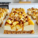 - 1 ½ cups graham cracker crumbs - ½ cup unsalted butter, melted - 1 cup cream cheese, softened to room temperature - ½ cup granulated sugar - 2 large eggs, at room temperature - 1 teaspoon vanilla extract - 2 cups apples, peeled, cored, and diced - 1 teaspoon ground cinnamon - ½ cup caramel sauce - ¼ cup chopped nuts For the best flavor in your cheesecake bars, I suggest using Granny Smith or Honeycrisp apples. These apples bring a nice balance of sweet and tart flavors. Granny Smith apples add a crisp bite, while Honeycrisp apples offer a juicy sweetness. Both varieties work well in this dessert. If you need to swap ingredients, here are some ideas: - Use salted butter instead of unsalted butter. - Cream cheese can be replaced with mascarpone for a richer taste. - For a dairy-free option, try a plant-based cream cheese. - If you don’t have graham crackers, use crushed cookies or digestive biscuits. - You can substitute chopped nuts with seeds for a nut-free option. Start by preheating your oven to 325°F (160°C). Grab a 9x9 inch baking pan and lightly grease it with cooking spray or butter. This step helps stop the cheesecake from sticking. In a medium bowl, mix 1 ½ cups of graham cracker crumbs with ½ cup of melted unsalted butter. Stir until it is well combined. Press this mixture evenly into the bottom of your greased pan. This forms a solid base for your bars. In a large mixing bowl, beat together 1 cup of softened cream cheese and ½ cup of granulated sugar. Use an electric mixer for about 2 minutes until the mixture is creamy. Don’t forget to scrape the sides of the bowl. Next, add 2 large eggs one at a time, mixing on low speed. Blend in 1 teaspoon of vanilla extract until everything is smooth. In another bowl, toss 2 cups of diced apples with 1 teaspoon of ground cinnamon. This adds great flavor. Gently fold the apple mixture into your cream cheese mixture. Do this carefully to keep some apple chunks. Pour this mixture over your graham cracker crust in the pan. Drizzle ½ cup of caramel sauce on top and use a knife to swirl it into the cheesecake. Sprinkle ¼ cup of chopped nuts over the top for added crunch. Place your pan in the oven and bake for 40-45 minutes. The cheesecake should be set but still jiggle slightly in the center. This indicates a creamy texture. After baking, let the pan cool at room temperature for about 30 minutes. Then, transfer it to the fridge to chill for at least 2 hours. Once cold, cut into squares or bars. For a delightful touch, drizzle extra caramel sauce just before serving. Enjoy your delicious caramel apple cheesecake bars! To make your cheesecake bars creamy, start with room temperature cream cheese. This helps it mix smoothly. Beat the cream cheese with sugar until it’s light and fluffy. Add eggs one at a time, mixing gently. This keeps the mixture airy. Do not overmix after adding the apples. A few small chunks add great texture. For a beautiful look, drizzle caramel sauce over the cheesecake layer. Use a knife or toothpick to swirl it in. Be careful not to mix it all in. You want to see the caramel swirls on top. This creates a lovely marbled effect that catches the eye. Taste your mixture before baking. If you want it sweeter, add more sugar. You can also use less sugar if you prefer a less sweet treat. Remember that the caramel sauce adds sweetness too. Adjusting the sweetness gives you control over your final flavor. {{image_4}} You can change the nuts on top to fit your taste. I like walnuts and pecans. They add crunch and flavor. You could also try almonds or hazelnuts. Just chop them up and sprinkle them on. This gives your bars a fun twist. The nuts also add healthy fats. While apples shine in this recipe, feel free to explore other fruits. Pears work well too, with their sweet and juicy texture. You can even mix apples and pears for a new taste. Berries like raspberries or blueberries can add a fresh burst of flavor. Just keep in mind that moisture levels may change with different fruits. If you want to switch up the crust, there are many options. You can use crushed cookies, like Oreos or vanilla wafers, for a sweet spin. For a gluten-free option, try almond flour or gluten-free graham crackers. A cookie crust can give it a unique taste. You can even add spices like nutmeg or ginger to the crust for extra flavor. To keep your caramel apple cheesecake bars fresh, store them in an airtight container. This helps to maintain their creamy texture and delicious flavor. If you plan to eat them within a few days, the fridge is perfect. Just make sure they are completely cool before sealing them away. You can also use plastic wrap to cover the bars if you don't have a container. When stored properly, these cheesecake bars last about 5 to 7 days in the fridge. Keep an eye on them for any changes in texture or smell. If you notice anything off, it’s best to throw them out. Always remember: when in doubt, throw it out! Yes, you can freeze these bars! To do this, cut them into squares first. Wrap each square tightly in plastic wrap. Then, place them in a freezer-safe container. They stay fresh for up to 3 months in the freezer. When you’re ready to enjoy them, just thaw them in the fridge overnight. They will taste fresh and delicious, just like when you first baked them! Yes, you can use different cheeses. Cream cheese gives a smooth texture. You could try mascarpone for a rich taste. Ricotta is another great choice. Just remember, the flavor will change a bit. No worries if you lack graham crackers. You can use crushed cookies or vanilla wafers instead. You can also try crushed pretzels for a salty twist. Just mix them with the melted butter as you would with graham crackers. The bars are done when they puff slightly. They should have a slight jiggle in the center. A toothpick inserted should come out mostly clean. If you see wet batter, bake a bit longer. You can make these bars ahead of time. They taste great after chilling in the fridge. Prepare them a day before serving for the best flavor. Just cover them tightly to keep them fresh. You learned how to make delicious caramel apple cheesecake bars. We covered the key ingredients, from the best apples to crust options. I shared easy steps for baking and tips for a great texture. You can explore variations with different nuts or fruits and learn how to store them well. Enjoy your baking adventure and feel free to make it your own!