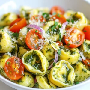 The key to a great Creamy Pesto Tortellini Salad is using fresh and tasty ingredients. Here’s what you will need: - 12 oz cheese tortellini - 1 cup cherry tomatoes, halved - 1 cup fresh spinach, roughly chopped - ½ cup creamy pesto (your choice of store-bought or homemade) - ½ cup grated Parmesan cheese - ¼ cup red onion, finely chopped - 1 tablespoon lemon juice - Salt and freshly ground black pepper to taste - 2 tablespoons extra virgin olive oil Each ingredient plays a role in making this salad vibrant and full of flavor. The cheese tortellini gives it a hearty base. The cherry tomatoes add a burst of sweetness. Fresh spinach brings in a crunchy texture. Creamy pesto ties it all together with a rich taste. Grated Parmesan adds a salty kick. Red onion offers a mild sharpness. Lemon juice brightens the flavors, while olive oil enriches the dressing. Salt and pepper enhance everything. Feel free to mix and match ingredients based on your taste. This dish is all about enjoying fresh flavors! {{ingredient_image_2}} Boiling the Water Start by filling a large pot with water. Add a good pinch of salt. Turn on the heat to high. Wait until the water boils vigorously. Cooking Time and Method Once the water is boiling, add 12 oz of cheese tortellini. Cook them for 3 to 5 minutes. Follow the package instructions for the best results. Check that they are tender yet firm, or al dente. Drain the cooked tortellini. Rinse them under cold water to stop the cooking process. Combining Tortellini with Vegetables In a large mixing bowl, add the cooled tortellini. Toss in 1 cup of halved cherry tomatoes, 1 cup of roughly chopped fresh spinach, ½ cup of grated Parmesan cheese, and ¼ cup of finely chopped red onion. Mix gently to blend all the ingredients. Preparing the Dressing In a separate small bowl, whisk together ½ cup of creamy pesto, 1 tablespoon of lemon juice, and 2 tablespoons of extra virgin olive oil. Mix until the dressing is smooth and creamy. This adds a rich flavor to your salad. Tossing Ingredients Together Pour the creamy pesto dressing over the tortellini mixture. Gently toss everything together. Make sure every piece is well-coated in the dressing. Chilling Time Taste the salad and season it with salt and freshly ground black pepper. If you want a stronger pesto taste, add more creamy pesto. Cover the bowl with plastic wrap or a lid. Place it in the fridge to chill for at least 30 minutes. This helps the flavors blend nicely. Serve the salad cold or at room temperature. Cooking Tortellini to Al Dente Cook the cheese tortellini in a large pot of salted water. Boil it for about 3 to 5 minutes. You want them tender but still firm. This is called al dente, which means "to the tooth" in Italian. Drain the tortellini once cooked, and do not forget to rinse them under cold water. This stops the cooking and keeps them perfect. Proper Cooling Techniques After rinsing, spread the tortellini on a baking sheet in a single layer. This helps them cool down quickly. You want to avoid them sticking together as they cool. Once cool, they are ready for your salad. Seasoning Suggestions Taste your salad before serving. Add salt and freshly ground black pepper to your liking. This step is key. A little seasoning can make a big difference in flavor. Customizing Pesto Flavor If you want a stronger pesto taste, add a bit more creamy pesto. You can also mix in a touch of lemon juice to brighten the flavor. Experimenting with herbs like basil or parsley can also change the taste. Garnishing Ideas For a pretty touch, add extra grated Parmesan cheese on top. A few fresh spinach leaves can add color too. These simple garnishes make your dish look fancy. Best Accompaniments This salad pairs well with crusty bread or a light soup. You can also serve it with grilled chicken for a heartier meal. Enjoy the blend of fresh flavors! Pro Tips Use Fresh Ingredients: Using fresh spinach and ripe cherry tomatoes will enhance the flavor and texture of your salad, making it more vibrant and delicious. Chill Before Serving: Allowing the salad to chill for at least 30 minutes lets the flavors meld together, resulting in a more cohesive taste experience. Customize Your Pesto: Feel free to experiment with different types of pesto, such as sun-dried tomato or arugula pesto, to give your salad a unique twist. Add Protein: To make this salad more filling, consider adding grilled chicken, shrimp, or chickpeas for a protein boost. {{image_4}} Alternative Vegetables You can change up the veggies in this salad. Try bell peppers, cucumbers, or zucchini. Each adds a unique crunch and flavor. You can also swap in arugula for spinach. It gives a nice peppery kick. Different Cheese Options If you want to mix the cheese, use feta or goat cheese. Both add a tangy taste. You could also use a mix of cheeses for more depth. Just remember, cheese adds creaminess and flavor. Gluten-Free Options To make this salad gluten-free, use gluten-free tortellini. Many brands offer tasty options. You can also use a gluten-free pasta, like rice or quinoa pasta. Just cook it according to the package instructions. Vegan Substitutes For a vegan version, choose a vegan tortellini. Many stores sell these now. Swap the creamy pesto for a vegan version. Use nutritional yeast instead of Parmesan. It gives a nice cheesy flavor without dairy. Summer Fresh Veggies In summer, add fresh corn or diced avocado. They make the salad bright and refreshing. You can also include grilled veggies for a smoky taste. Cherry tomatoes are sweetest in summer, so use lots! Fall Flavor Boosters As fall arrives, consider adding roasted butternut squash or sweet potatoes. They add a warm, sweet flavor. You might also try adding walnuts for crunch and a hint of nutty flavor. This gives your salad a cozy vibe perfect for fall. To keep your creamy pesto tortellini salad fresh, store it in an airtight container. This will help lock in flavors and prevent any unwanted smells in the fridge. Always let the salad cool to room temperature before sealing it. The salad stays tasty for up to three days in the fridge. However, the longer it sits, the softer the veggies may become. You can freeze tortellini salad, but it’s not ideal. Freezing can change the texture of the tortellini and veggies. If you choose to freeze it, use a freezer-safe container. It’s best to eat it within a month for the best taste. When you want to enjoy your frozen salad, thaw it in the fridge overnight. This keeps the salad cold and helps maintain its flavor. After thawing, give it a good stir and check for seasoning. You may need to add a little salt, pepper, or even more pesto to refresh the taste. Ingredients Needed: - 2 cups all-purpose flour - 3 large eggs - 1/2 teaspoon salt - 1 cup ricotta cheese - 1/2 cup grated Parmesan cheese - Fresh herbs (basil or parsley) Simple Steps to Follow: 1. In a bowl, mix flour and salt. 2. Make a well in the center and add eggs. 3. Stir until dough forms. Knead for 8-10 minutes. 4. Let dough rest for 30 minutes. 5. Roll out dough thinly. Cut into squares. 6. Fill each square with ricotta mix and fold into triangles. 7. Pinch edges to seal. Your tortellini is ready to cook! Recommendations for Quality: Yes, store-bought pesto is a great option. Look for brands with fresh ingredients. Flavor Considerations: Taste different brands to find the one you love. Some can be too oily or salty. Choose one that balances flavor well. Alternative Pasta Types: You can use any small pasta, like shells or farfalle. These shapes hold the sauce nicely. Cooking Adjustments Needed: Cooking times may vary based on the pasta type. Check the package for guidance to ensure it cooks perfectly. This blog post covers a tasty tortellini salad. You learned about key ingredients, cooking methods, and mixing tips. I shared how to enhance flavors and suggested alternatives for your needs. You saw storage tips to keep it fresh and answers to common questions. Enjoy this simple yet delightful dish as a healthy meal or side. With these steps, you can impress family and friends with ease. Try different flavors and make it your own!