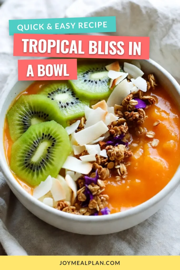 Discover the bliss of a tropical mango smoothie bowl, perfect for a quick, healthy breakfast or snack! This easy healthy smoothie bowl recipe combines ripe mangoes, bananas, and creamy coconut milk, making it a delicious vegan mango smoothie bowl option. Top it off with refreshing smoothie bowl toppings like kiwi, coconut, and granola for extra flavor. Try this coconut milk smoothie bowl today and elevate your mornings! Save for later! #SmoothieBowl #VeganRecipes #HealthyEating #TropicalFoods